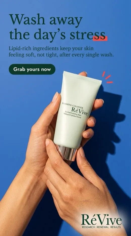 RéVive foaming cleanser ad — hands cradling the tube against a bold blue backdrop