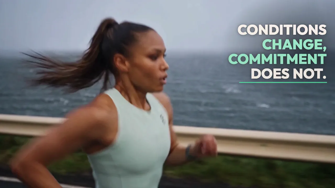 On Cloudrunner 3 Max spec film with motion graphics. A runner in a mint tank top on a wet coastal road beside the kinetic line Conditions change, commitment does not